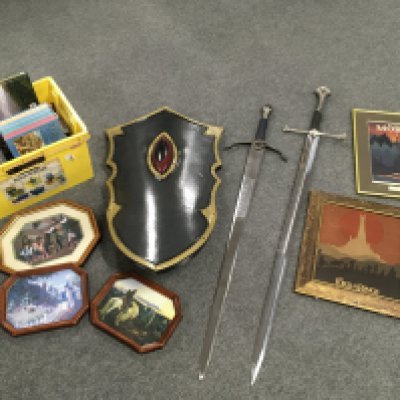 A collection of 'Lord Of The Rings' items comprising two swords, a shield etc.