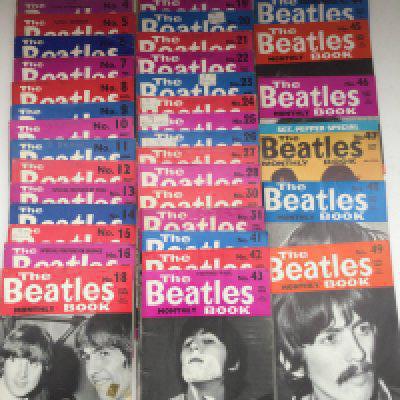 A bag of Beatles memorabilia comprising Beatles Book Monthlies 4-16, 18-28, 30-31 and 41-49, two scrapbooks, a September 1964 'In His Own Write' and other items.