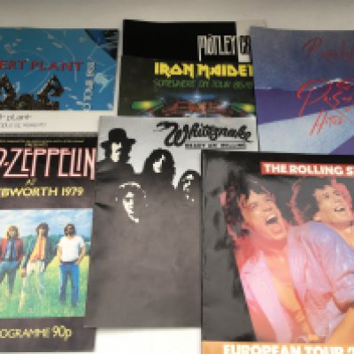 A collection of music programmes for various artists comprising Led Zeppelin, B B King, Genesis, Queen, The a Rolling Stones and many more including a signed Buddy Rich example. Also includes three NME music papers and a guitar heroes magazine.