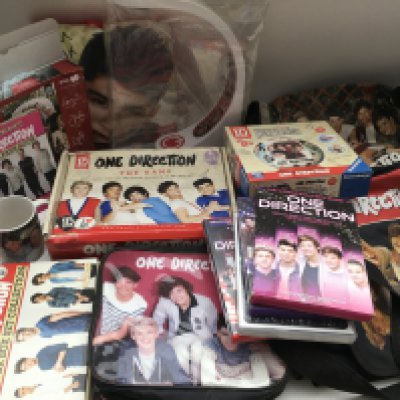 A box of One Direction memorabilia.