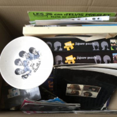 Two boxes of music ephemera comprising mainly Beatles related items including a Beatles Get Back book in very poor condition, two vintage plates, books, jigsaws etc.