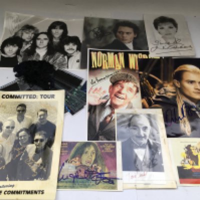 A box of music, TV and film memorabilia comprising various autographs, publicity prints, Avengers action figures, film cels etc.