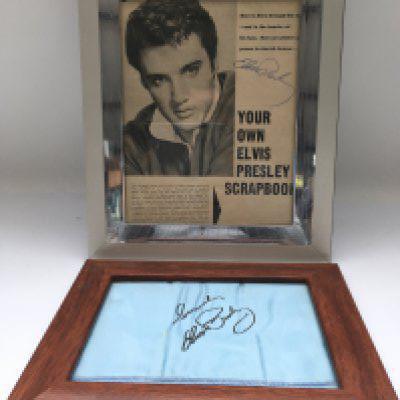 A framed Elvis Presley signed magazine page and a framed Elvis Presley light blue stage scarf with facsimile autograph of Elvis (2). These scarves were handed out at concerts in the 1970s. No COAs. Please note that buyers must satisfy themselves as to the authenticity of any signed items before bidding as we are not experts in this field and will not be held responsible should they prove to be anything other than genuine.