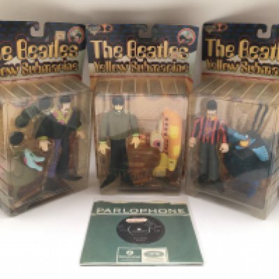 Three sealed McFarlane toys Beatles Yellow Submarine figures and a mint 'Yellow Submarine' 7" single.