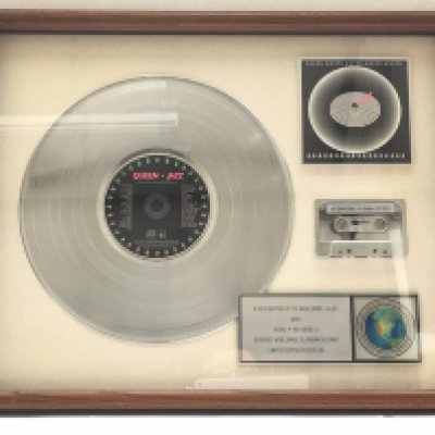 A framed and glazed limited edition platinum disc, CD and cassette display in recognition for worldwide sales of the Jazz album by Queen. Number 24/60. Approx 54cm x 44cm.