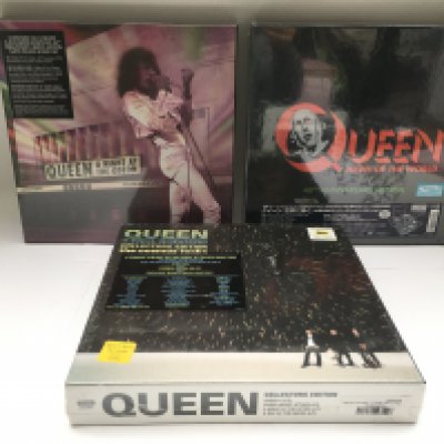 Three mint and sealed Queen multi LP/CD/BluRay/DVD box sets comprising a 40th Anniversary 'News Of The World', 'A Night At The Odeon' and 'The Cosmos Rocks'.