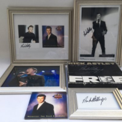 A collection of Rick Astley items comprising five signed items, a pre release promo box, press photos, CD etc.