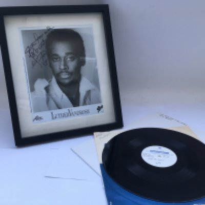 A signed Luther Vandross publicity print and a 'Stop To Love' acetate.