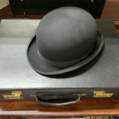 The personalised brief case for Danny La Rue together with a his Bowler Hat and Brief case contents. Both with his personal intials (C)