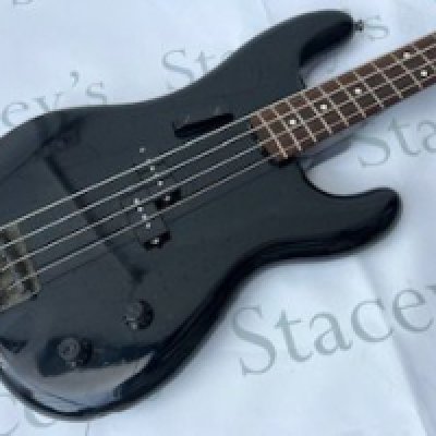 A 1986 Fender Japan Precision Bass Guitar in Black.In fair to good condition overall. Some light marking, scratches and playwear to body but no significant or major damage. Tarnishing to bridge. Missing Fender logo to top of tone control. Light playwear to neck but no significant wear to frets. Comes with non original hard case.