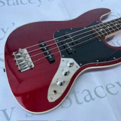 A 2007 Fender Japan "Crafted in Japan" Aerodyne Jazz Bass in Seminole Red Metallic - all original and in fair to good condition with playwear and some scratches to the body. Very light fretwear and some light tarnishing to the brightwork. Light edge wear to the headstock. Comes with non original hard case.