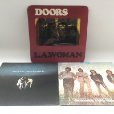 Three early UK pressings of LPs by The Doors comprising 'LA Woman', 'Waiting For The Sun' and 'The Soft Parade'.