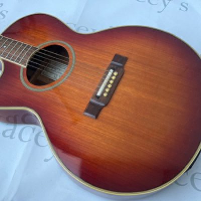 A left handed Washburn Festival Series Electro Acoustic Guitar sunburst finish. Overall good condition. No case.