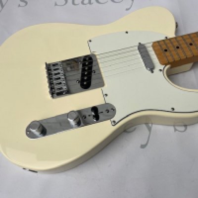 A 2012 Made in Mexico Fender Telecaster in Cream (Aged White with aged pick guard) Unplayed with no tarnishing to frets or brightwork. One small chip to the back and light edgewear. Comes with Fender gig bag.
