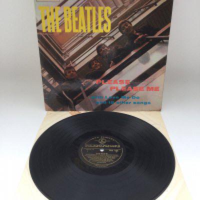 A first UK pressing of The Beatles 'Please Please Me' LP in mono with black and gold centre labels, Angus McBean credit aligned to the right of front cover and Dick James publishing credits. Vinyl Ex. Cover is bumped in corners and flipbacks are creased.