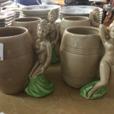A set four Dorothy Kindell pottery mugs the handles in the form of nude maidens. NO RESERVE
