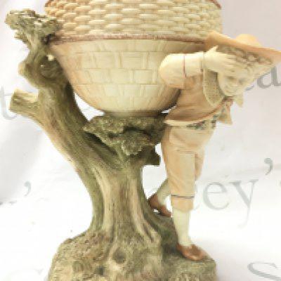 A Royal Worcester porcelain centre piece, with shaped bowl, on a tree bough aside figure 18cm tall. This lot cannot be posted