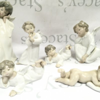 Six Lladro porcelain figures , this lot cannot be posted