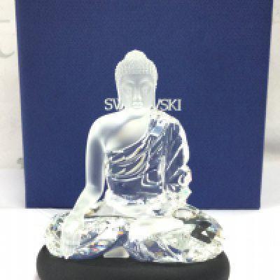 A boxed Swarovski crystal glass Buddha figure . No obvious damage or restoration. This lot cannot be posted