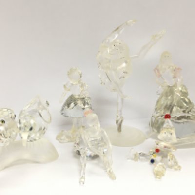 A collection of Swarovski crystal glass figures including Doves, Ballerina, Clown puppet, Cinderella . No boxes. This lot cannot be posted