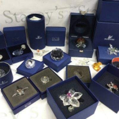 A collection of Swarovski Crystal glass ornaments including Orchid Blossom, Farewell to Concorde paperweight, vase of roses, bonsai rhodium , Parrot . This lot cannot be posted