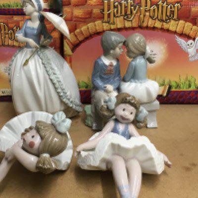 A Collection of four figures two Nao two Lladro.