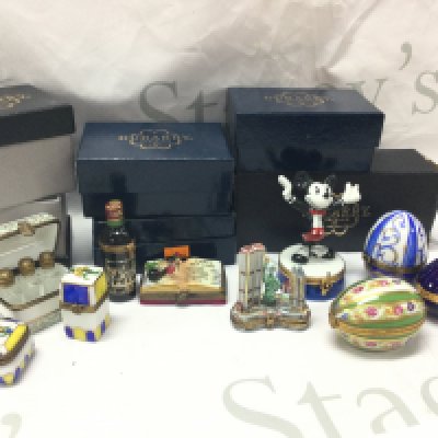 Boxed Dunbarry ceramic pill boxes including Mickey Mouse box, Petrvs bottle, eggs. This lot cannot be posted