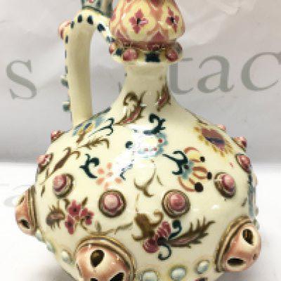 A Zsolnay Pecs pitcher, some crazing and fading to gilt, no obvious damage or restoration. Approximately 19cm tall. This lot cannot be posted