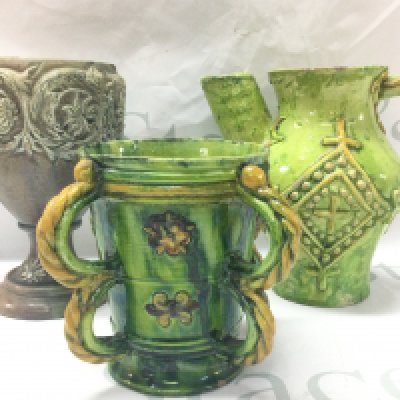 Three Castle Headingham pottery items including green and yellow glazed four handled jug and other jug and a goblet shaped vase . Tallest 18cm. This lot cannot be posted