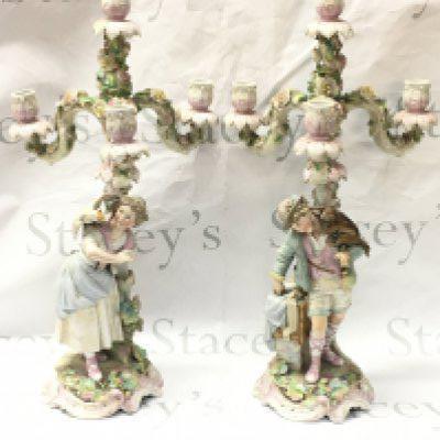 A pair of German porcelain candelabra couple figures with animals and floral decoration , 54cm tall . This lot cannot be posted