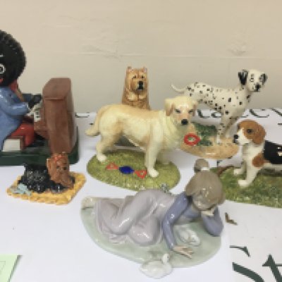 A Lladro figure Royal Doulton animal figures a Carlton Golly figure (damaged)