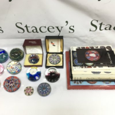 Twelve paperweights including Perthshire, Caithness and others plus some paperweight collector's books. Shipping category D.