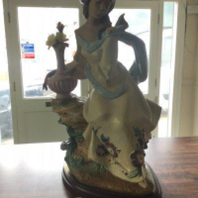 A Lladro Garden Breeze Gres figure, issued 2001 retired 2003. Lladro number 3583. Limited Edition of 1500. Flower petal needs re gluing. No other obvious damage or restoration. Including base 59cm tall. This lot cannot be posted