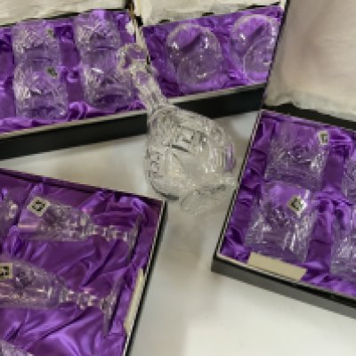 5 boxed Edinburgh crystal glass sets and a matching decanter.