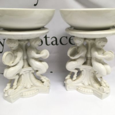 A pair of Meissen blanc de chine figural comports, approx height 28cm. Shipping category D.