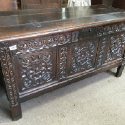 A large oak blanket box, the hinged lid above a carved panel front. 58cm x 140cm x 75 cm. NO RESERVE