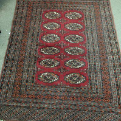A Persian wool rug. Approx measurements 182x128cm. NO RESERVE