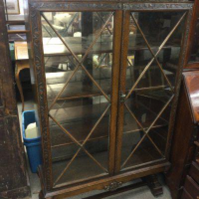 An Oak mid 20th century astral glazed cabinet with key . Dimensions 92cm wide 150cm tall 30cm deep