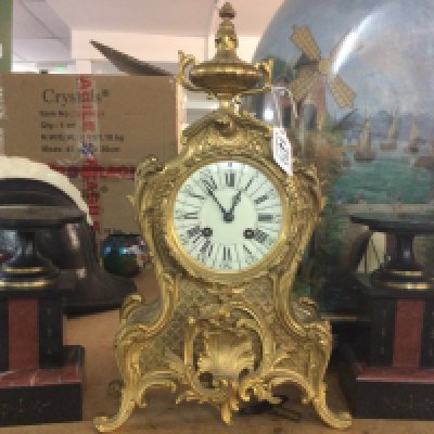 A French gilt Louis XV Style mantle clock 39cm tall. This lot cannot be posted