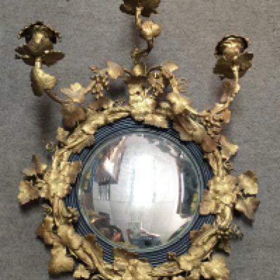 A quality 19th century gilt metal girandole wall mirror with a frame featuring twisted branches, leaves and grapes. 49cm wide. This lot cannot be posted