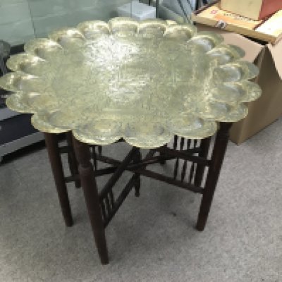 A brass top occasional table, approx diameter 60cm. Shipping category D.
