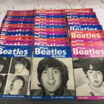 A collection of Beatles Book Monthly magazines comprising numbers 7-37, 39 and 40 plus some black and white press photos from A Hard Day's Night and a Meet The Beatles magazine. Shipping category B.