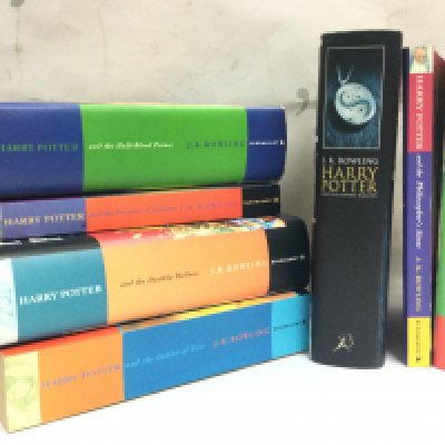 Seven Harry Potter books , three being first editions. Postage category B