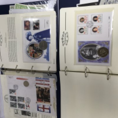 Five binders of mixed coin and stamp covers, coins including silver examples etc. Shipping category D.