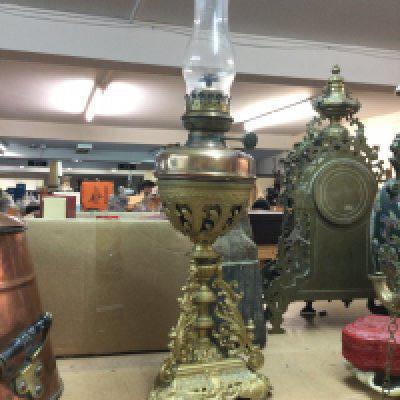A Victorian oil lamp on gilt metal base with funnel . 68cm tall total height. This lot cannot be posted