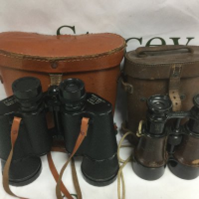 Two pairs of binoculars comprising an early 20th Century Hezzanith example and a later Zenith model (2). Shipping category D.- NO RESERVE
