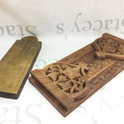 A carved wooden book slide and brass crib board. Postage category b