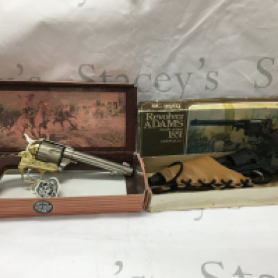 Three replica pistols, including a single action army colt 45, a double action 1851 revolver replica and a Remington style revolver.