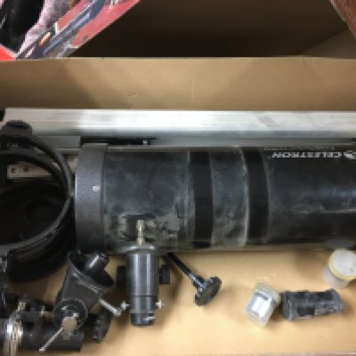 A celestron ps1000 telescope with stand and other attachments.