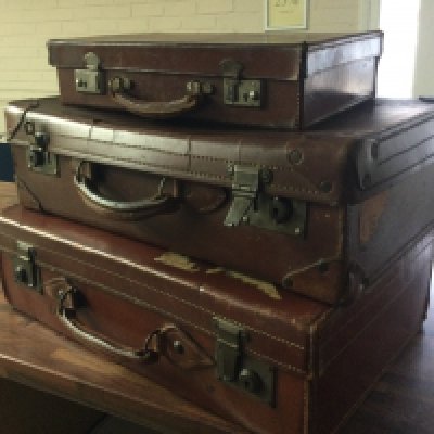 Three vintage leather suit cases . This lot cannot be posted